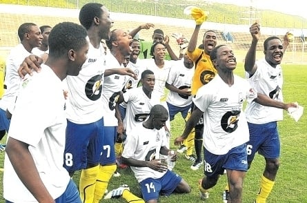 Hydel High players celebrate their extra time 2-1 win over Excelsior High in their Manning Cup semi-final match at the National Stadium yesterday. (Photo: Garfield Robinson)