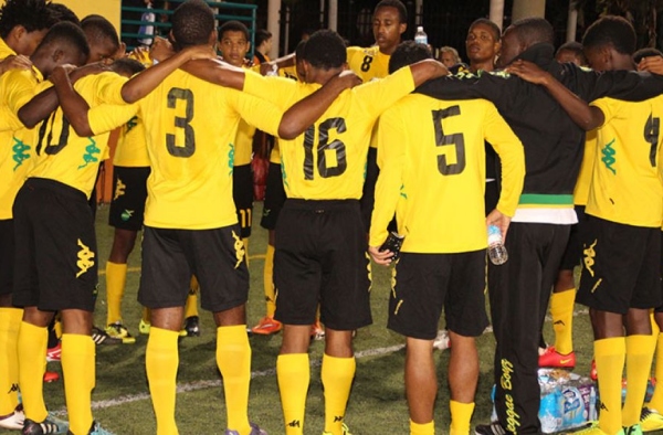 ETERNAL FATHER, BLESS US. Members of the Jamaica National U-17 team embrace each other prior to the start of their match with Plantation U-19, at the Lauderhill Stadium, Fort Lauderdale, Saturday. Jamaica won 4-1 and will play in the final on Sunday. Paul Perry Photo