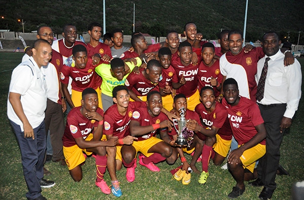Members of Wolmer’s team pose with the Walker Cup after defeating St George’s College 5-4 on penalties to win the Walker Cup at the Stadium East field.
